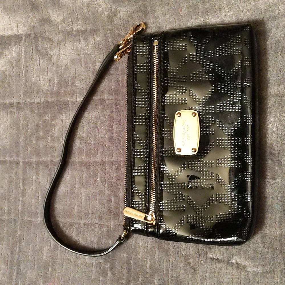 Michael Kors Patent Leather wristlet in black and gold hardware